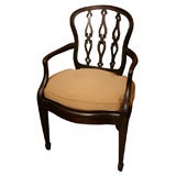 English, mahogany open arm chair with caned seat