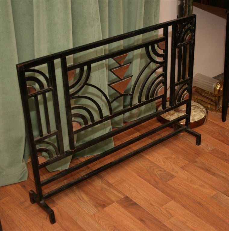 A French Art Deco Firescreen in black patinated wrought-iron with partially nickel-plated geometrical accents, from circa 1940's.