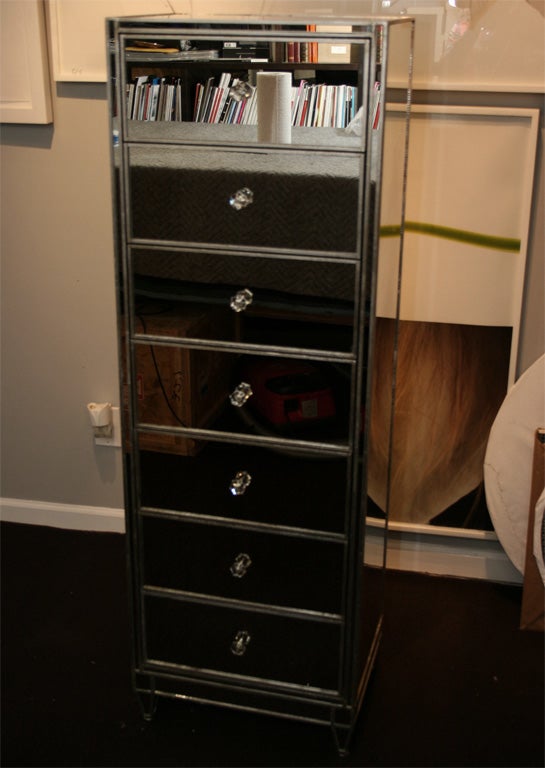 Custom silver trim mirrored semainier with 7 drawers. Customization is available in different sizes, finishes and hardware.