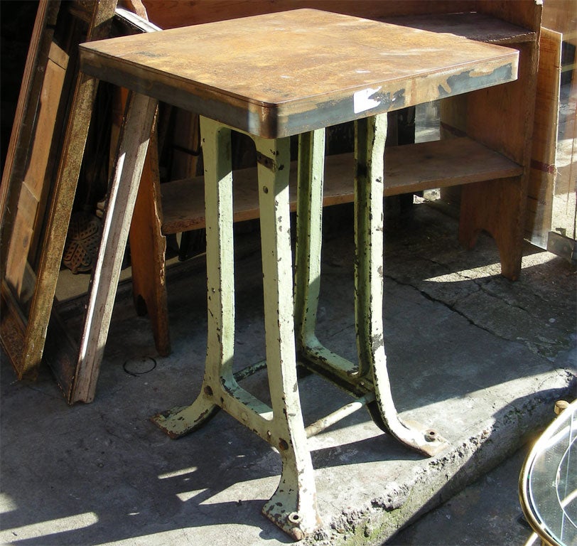 Tall 1900 cast iron table, with top iron surface added later.