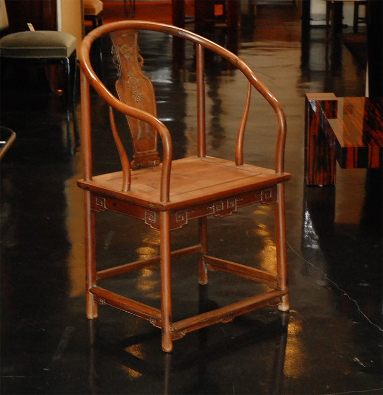 Chinese Horse Shoe Chairs<br />
Wonderful bat with tassle motif on backs<br />
Available separately for $1,950.00 ea
