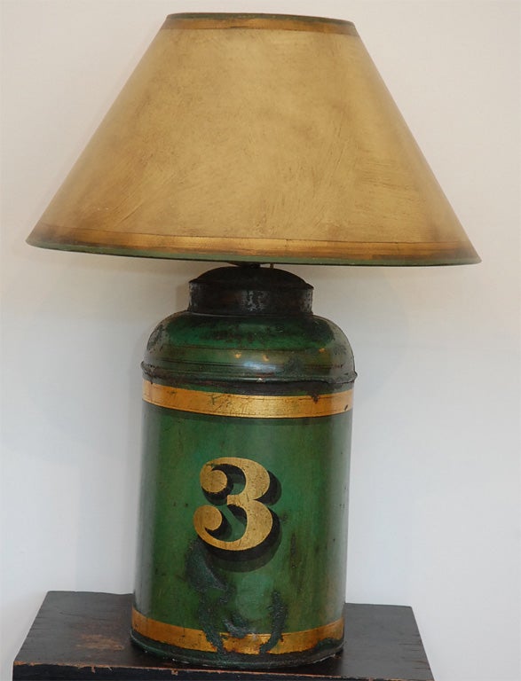 19TH C. ORIGINAL GREEN PAINTED TEA CANISTER LAMP WITH THE NUMBER 3 IN OLD GILDED GOLD PAINT.  CUSTOME MADE LAMP SHADE.
