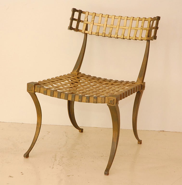 Set of 8 aluminum metal outdoor chairs in a Klismos style.  Solid and sturdy with a basket weave style back and seat.