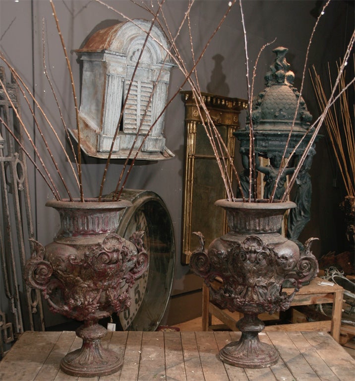 Pair of ornate French  19th century cast iron urns