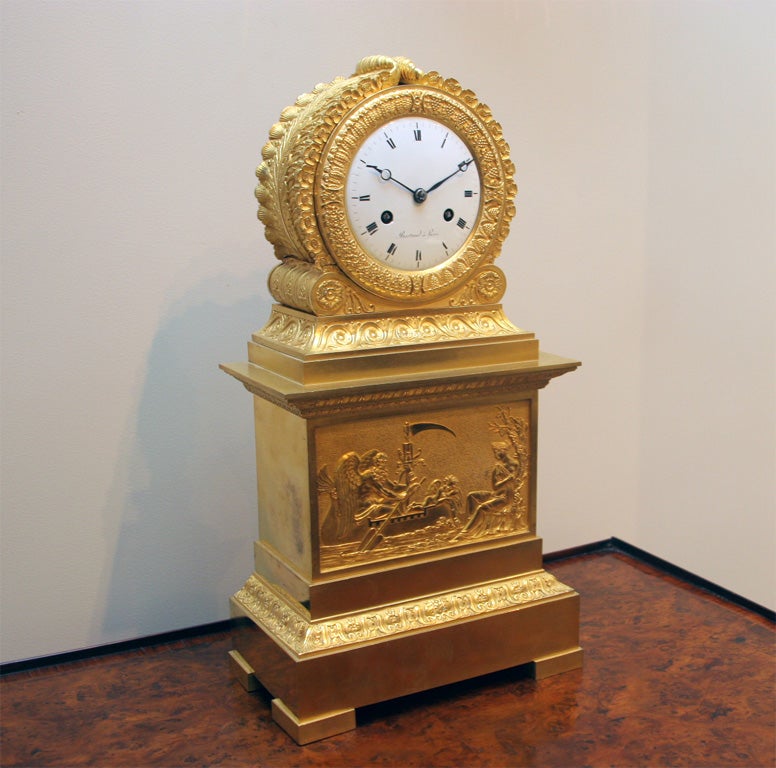 A very fine gilded bronze clock by Bertrand a Paris, with an original clock face and movement, having neoclassical acanthus

leaf and scrolled ormolu decoration, supported on bracket feet.