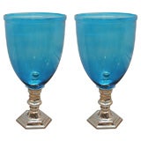 pair of acqua blue glass globes with silverplated stands