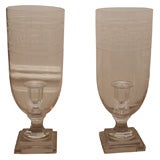 Pair of glass candlesticks with greek key etchings