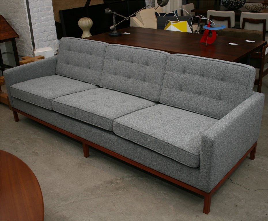 Florence Knoll 3 seat quilted sofa with wood base.  We have had the base stained a dark walnut finish.  Please call for more photos.