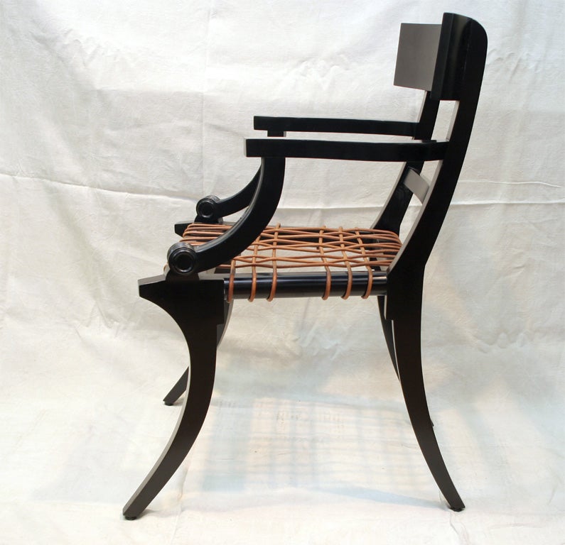 Made to Order Klismos inspired Arm Chair with Leather webbed seat.  (can be ordered with or without a decorative cushion)<br />
*Finishes - Dark Stained Walnut, Ebonized Wood, Mahogany<br />
*Seat Height - 17