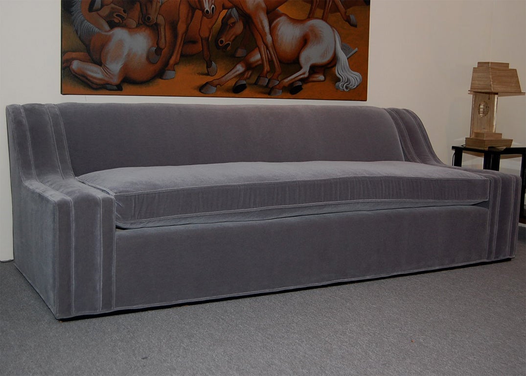 Wonderul glamorous sofa designed by JAMES MONT The sofa is beautifully executed and upholstered in a luxurious mohair velvet fabric which shows of the elegant lines of this great sofa.