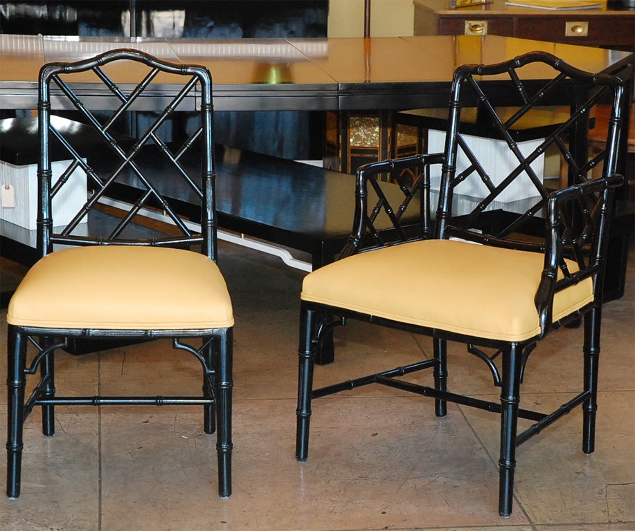 SET OF SIX BLACK LACQUERED FAUX BAMBOO CHAIRS. UPHOLSTERED IN YELLOW LEATHER. FOUR SIDE CHAIRS AND TWO ARMCHAIRS.