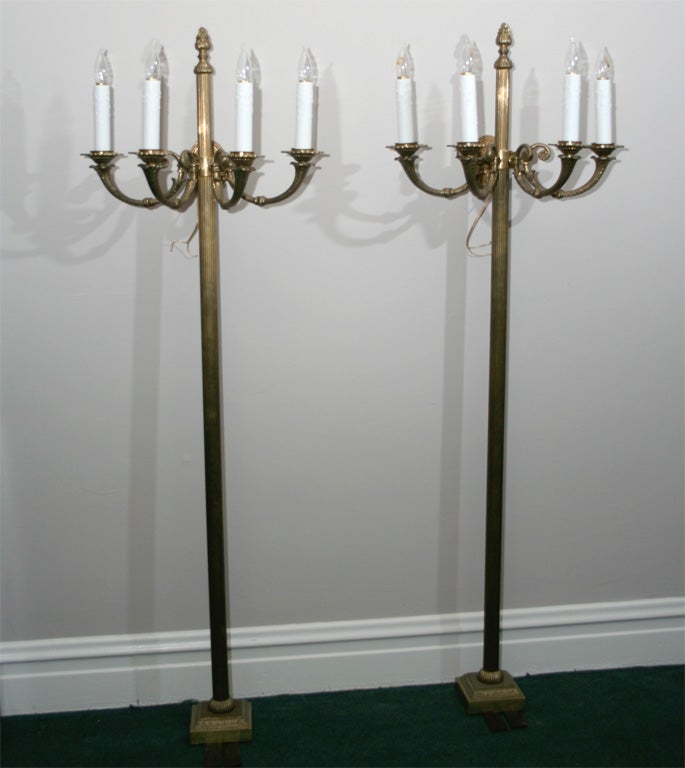 Pair of forged brass floor- and wall-mounted Tortiere lamps salvaged from entrance of hotel in Edinborough. Reeded columns.