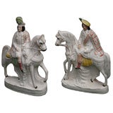 A pair of English Staffordshire figures on horses
