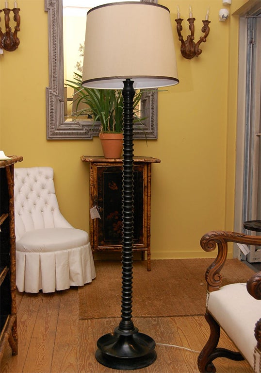 Smart looking ghee black twist floor lamp with satin ribbon trim shade.