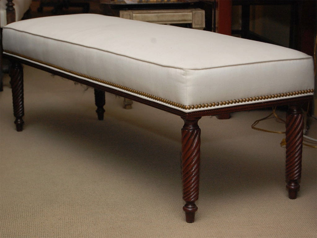 Sophisticated upholstered bench with fruitwood spiral legs, nailheads and muslin top. Great piece in any room of the home.