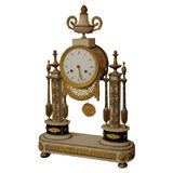 A Late 18th century Louis X V I gilt bronze and marble clock