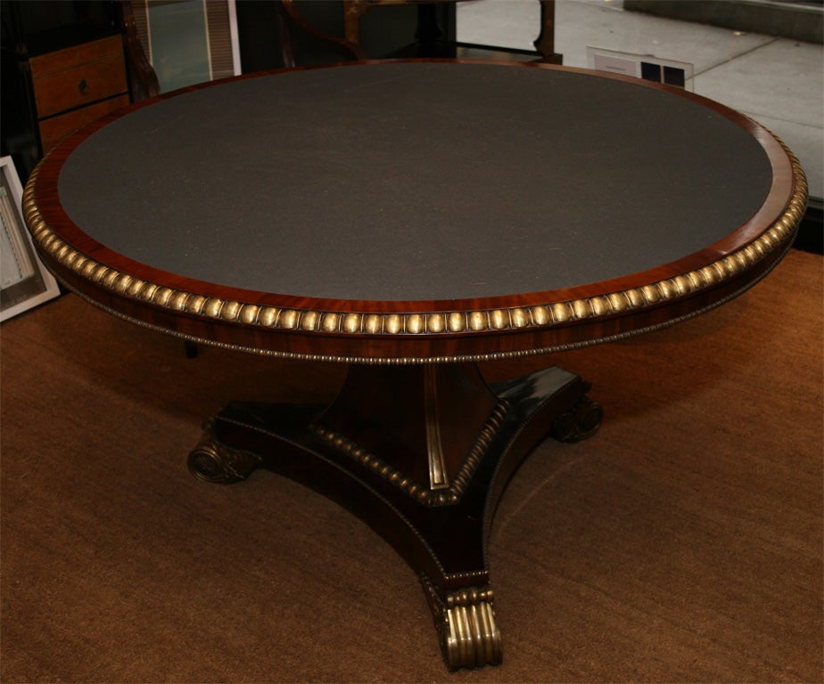 Regency ormolu-mounted mahogany center table.