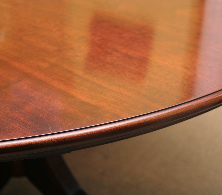 American An exceptional hand made mahogany round dining table with semi-circular leaves. For Sale