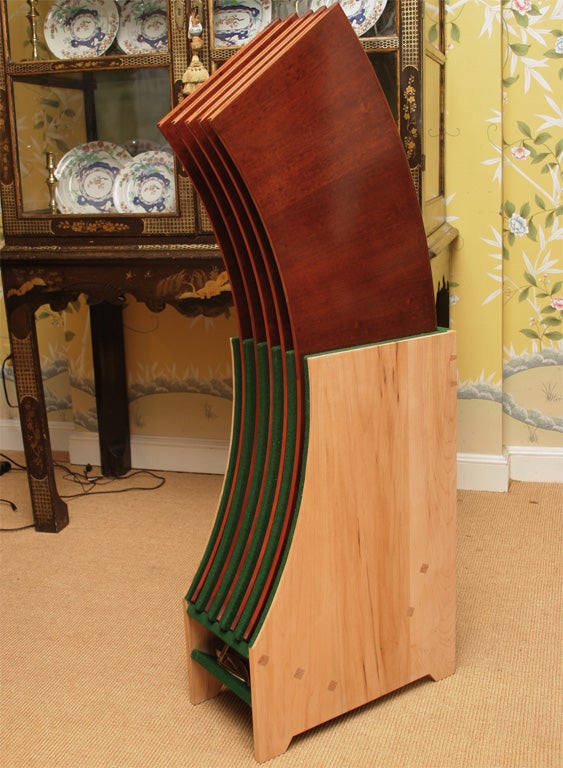 Carved An exceptional hand made mahogany round dining table with semi-circular leaves. For Sale