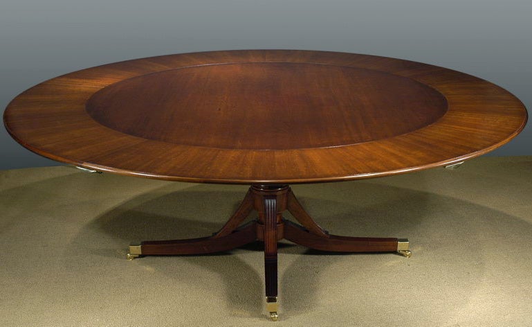 Contemporary An exceptional hand made mahogany round dining table with semi-circular leaves. For Sale