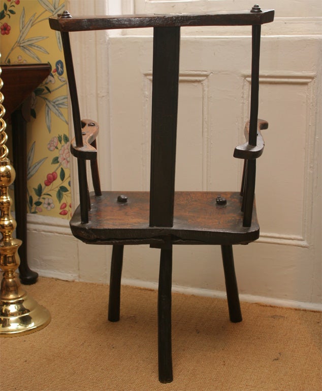 18th Century and Earlier A rare English elmwood and oak three legged shepherd's chair.