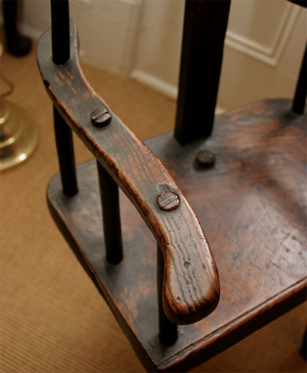 A rare English elmwood and oak three legged shepherd's chair. 2