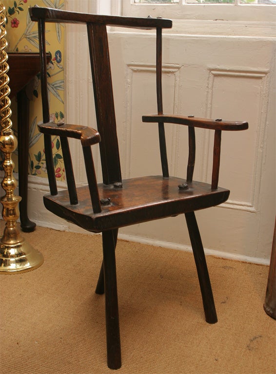 A rare English elmwood and oak three legged shepherd's chair. 4