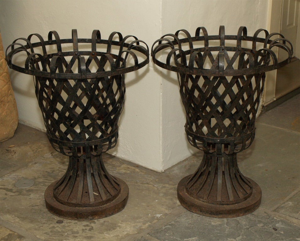 8202 A PAIR OF METAL URN SHAPED PLANTERS at 1stDibs