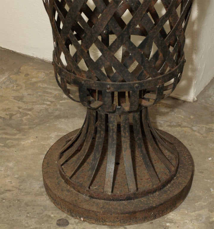 8202 A PAIR OF METAL URN SHAPED PLANTERS at 1stDibs