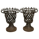 8202 A PAIR OF METAL URN SHAPED PLANTERS