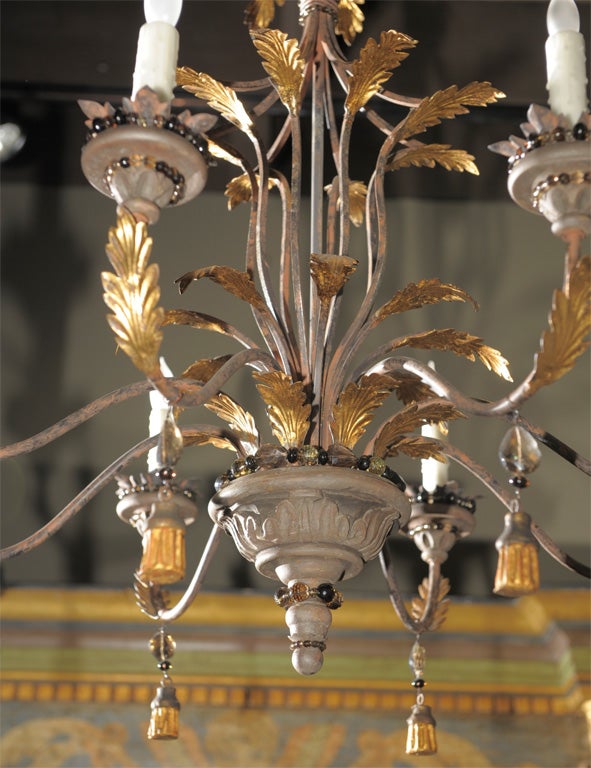 A Whimsical Gilt Tôle and Iron Chandelier