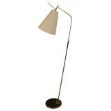 An Adjustable Brass Anglepoise Floor Lamp and Shade.