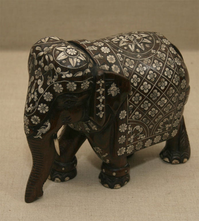 Pair of Small Carved Hardwood Elephants with Elaborate Ivory and Bone Inlay, Each Elephant Vested in Traditional Ceremonial Dress.  Anglo India, Late 19th Century / Early 20th Century.<br />
<br />
10 inches long x 5 inches deep x 8 inches high