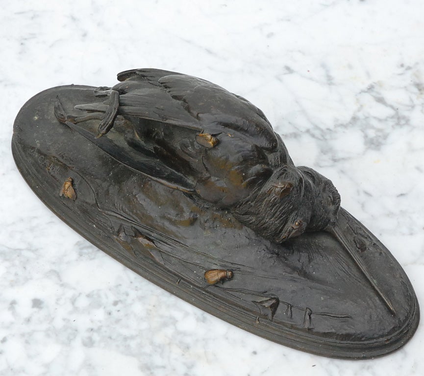 Cast bronze sculpture of a dead bird signed by A. Cain. August Nicholas Cain ( 1822-1894) of Animalier school, a traditional French draftsman. Samller pieces were made before 1868, and larger, monumental works were produced by Cain until his death