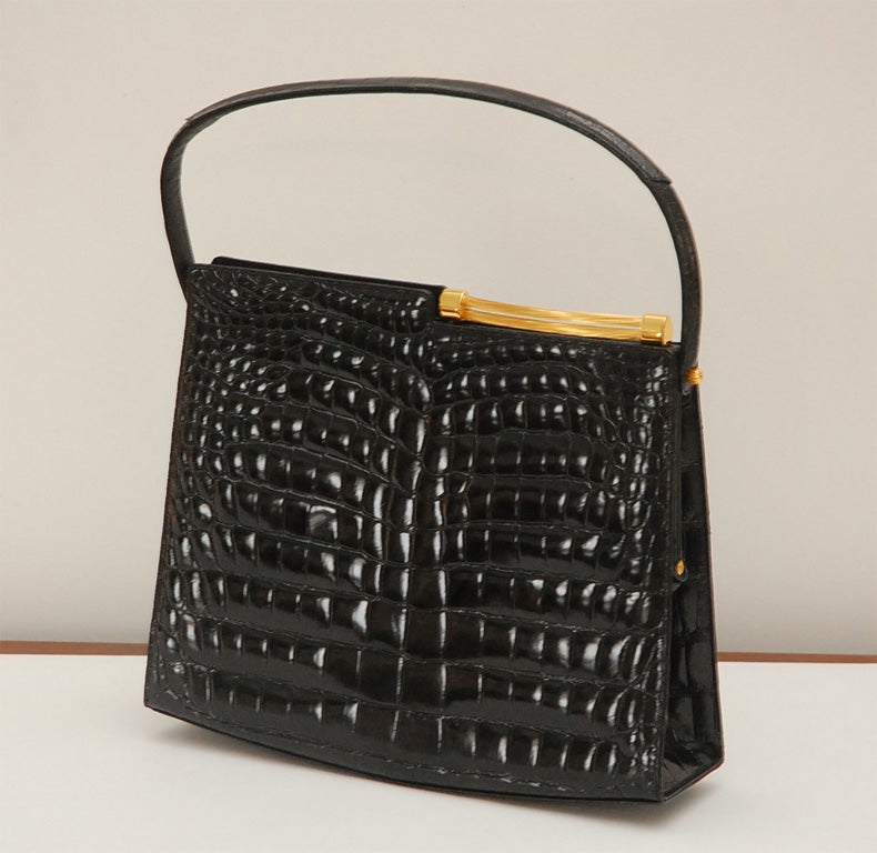 Vintage Rendl Original black alligator handbag in near mint condition- never used.  The interior change purse still has the original sales tag from Bullock's department store (see detail shot).<br />
<br />
The body of the handbag (exclusive of