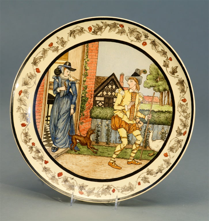 This is a whimsical Minton porcelain charger/plaque hand-painted in polychrome enamels all framed by a border of trailing grape leaves. The scene depicts an English countryman being turned away by a beautiful lady, with a shocked expression on his