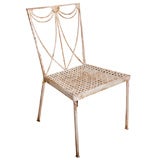 Vintage pair of painted iron chairs