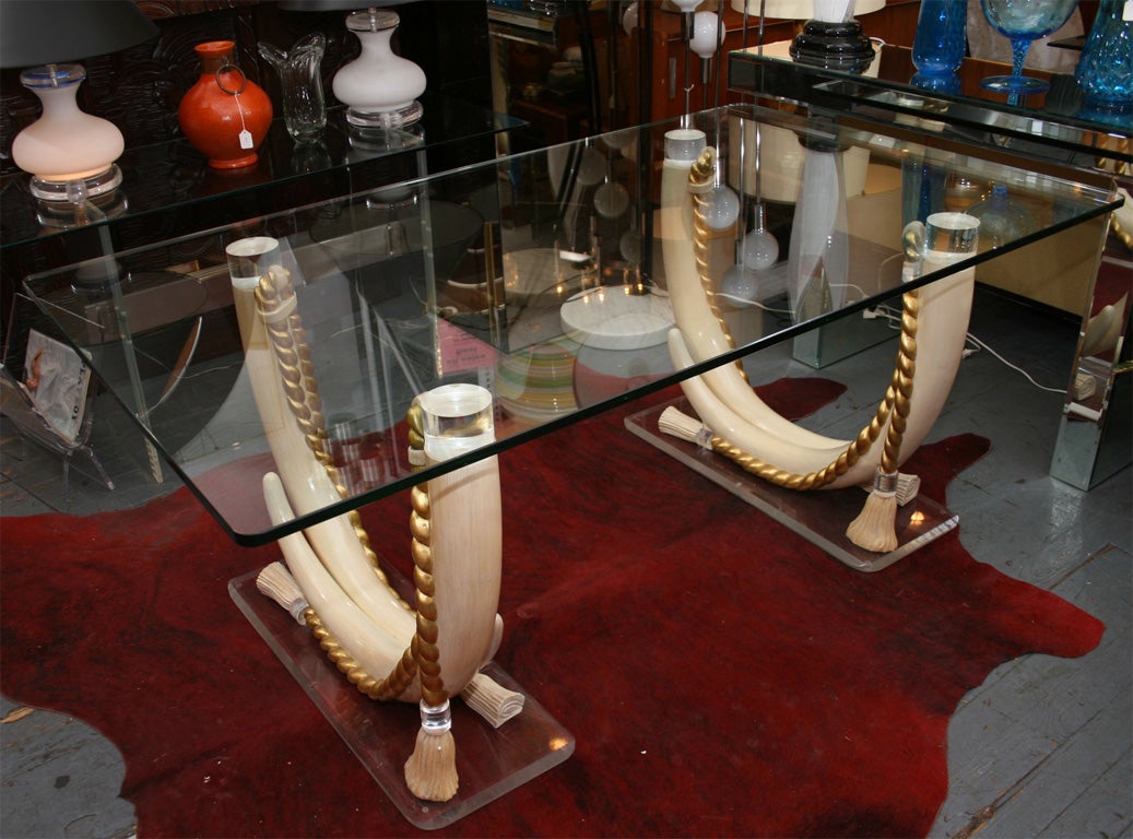 Glamorous faux elephant tusk table with heavy glass top.  Located @ LV2, 113 Stanton St. 212-358-8000.