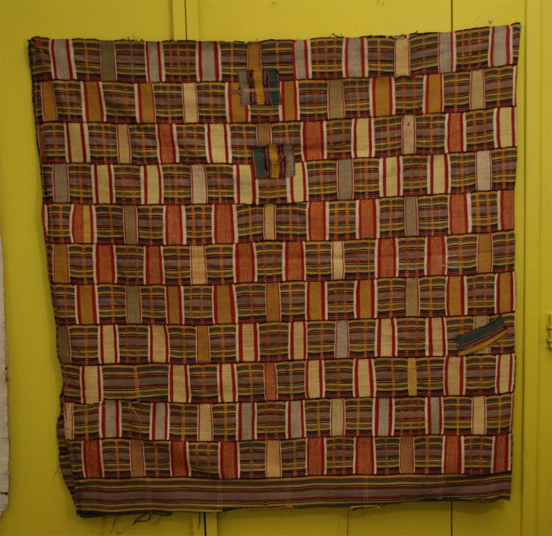 Kente cloth from Ghana, woven on a menora loom (strip weaving).