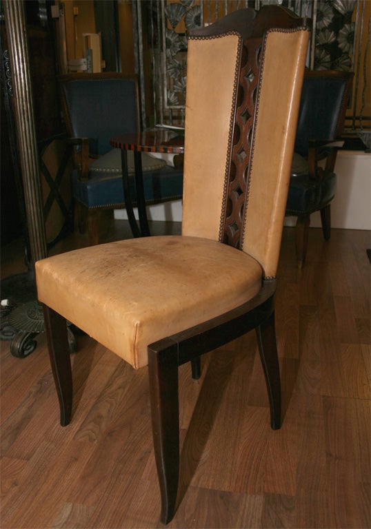 A Christian Krass set of seven Art Deco chairs

in mahogany wood with beige leather upholstery.