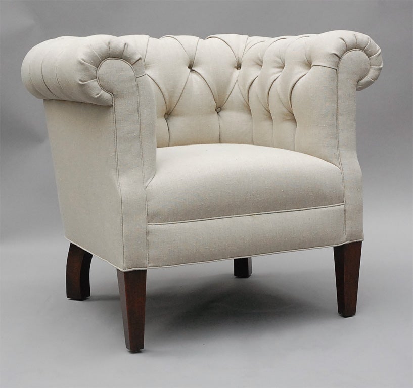 The Alston by Lee Stanton Editions is a classic but modern tufted armchair with rolled arms and tapered wood feet, upholstered in cream-colored Belgian linen or customer's own material (COM). $150 additional for casters. 

LEE STANTON EDITIONS,
