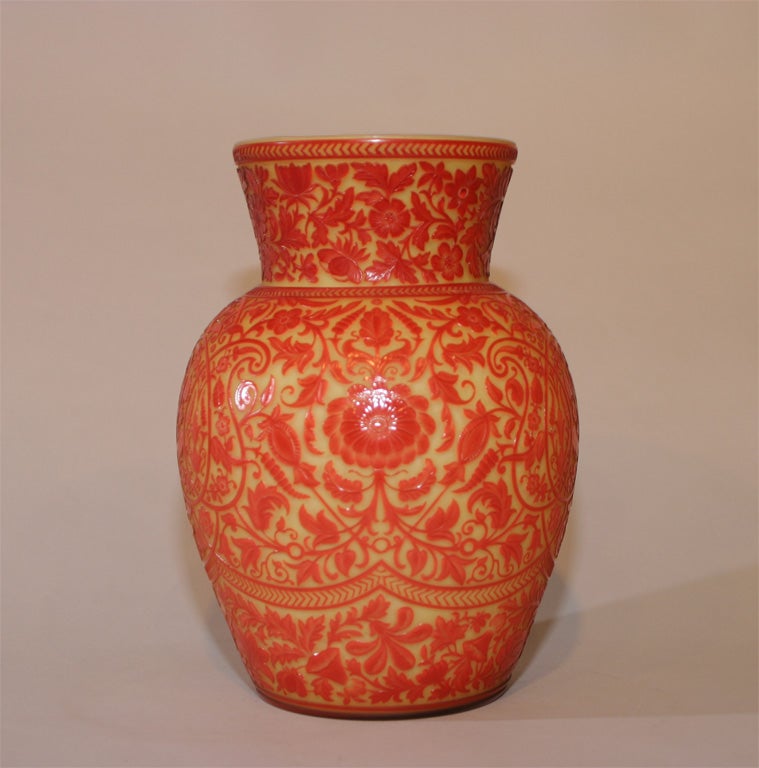 A rare unsigned Thomas Wewbb & Sons red on yellow cased cameo glass vase decorated with Oriental flowers and foliage, fire polished