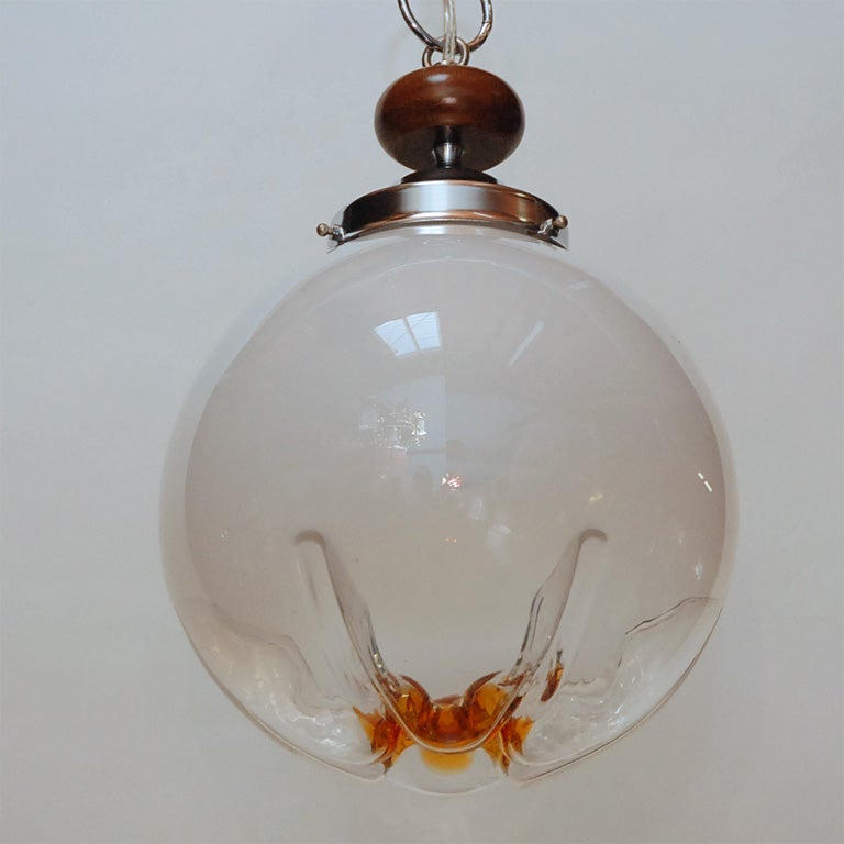 This attractive light fitting has an art glass shade which is said to be from Italy and produced by Mazzega. An attractive light for a number of settings.