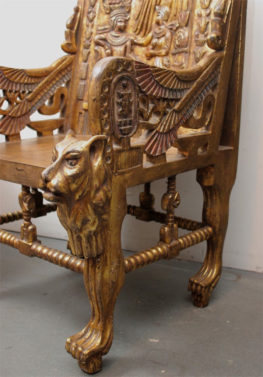 Pair of gilt-wood carved Egyptian style Throne chairs made after
Carter discovered Tutankhamun's tomb in the 1920's and started 
a craze for Egyptomania These thrones are extremely comfortable
see the article in the May 2009 Robb report page 68