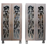 GRAND PAIR OF ARMOIRES WITH  CARVED MIRRORED DOORS AND HANDLES