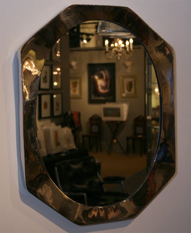 Interesting 1970's mirror with stainless steel, basically octagonal frame.