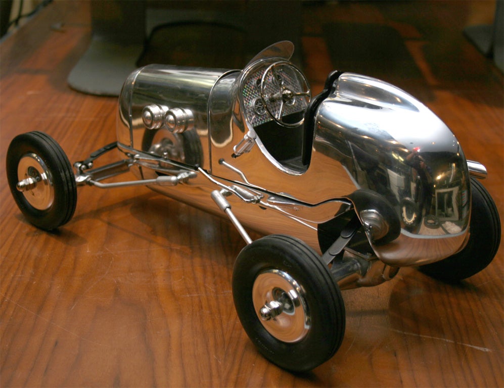 Scratch built, finely executed polished aluminum model car.