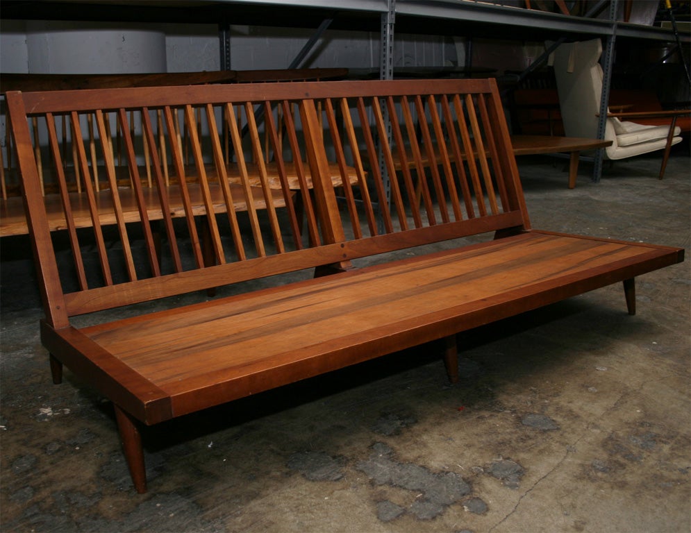 Armless Sofa in cherry with slatted back ( Accompanied by original sales receipt)