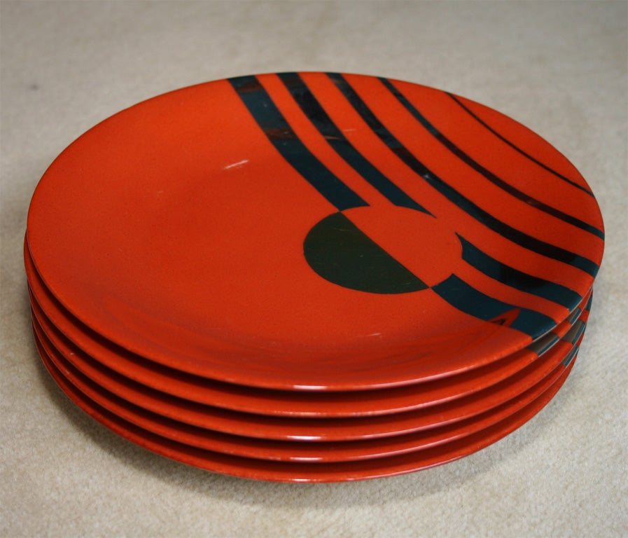 Set of five red plates with silver geometric decoration, stamped, by Jean Luce, French, Exhibited in the Paris Exposition in 1925