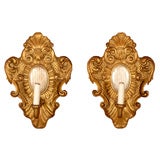 Pair of gold gilt and silver gilt wood sconces